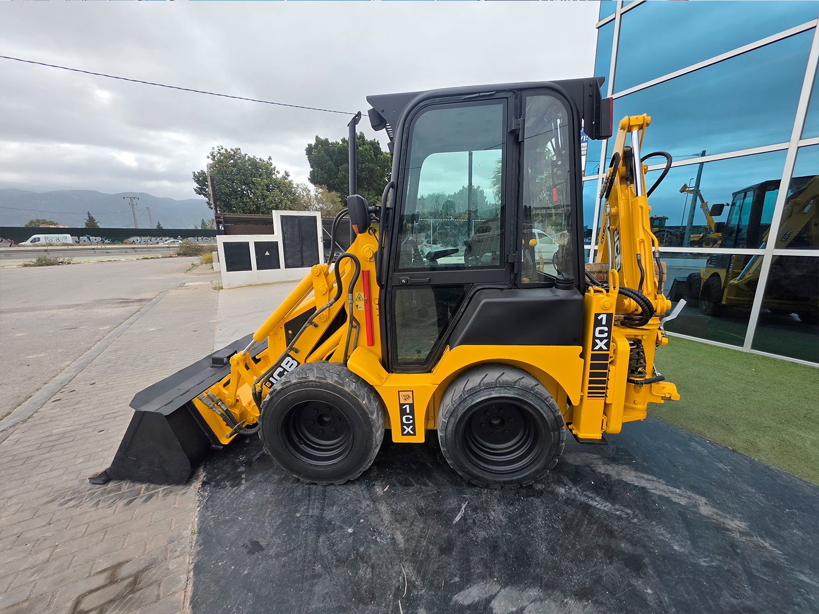 JCB 1CX en mantenimiento municipal Cabina panorámica JCB 1CX JCB 1CX segunda mano en venta