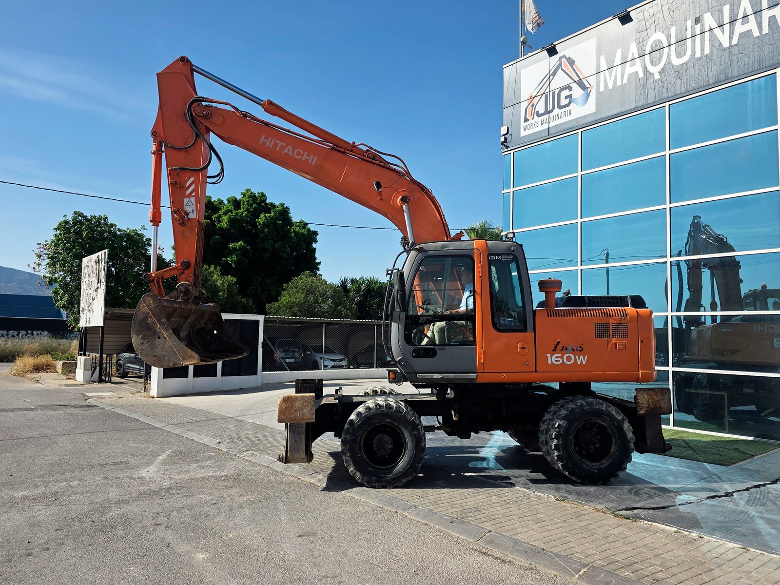 Hitachi ZX160W segunda mano vista lateral Excavadora de ruedas Hitachi ZX160W 2006 Hitachi ZX160W matriculada en venta Vista frontal Hitachi ZX160W usada