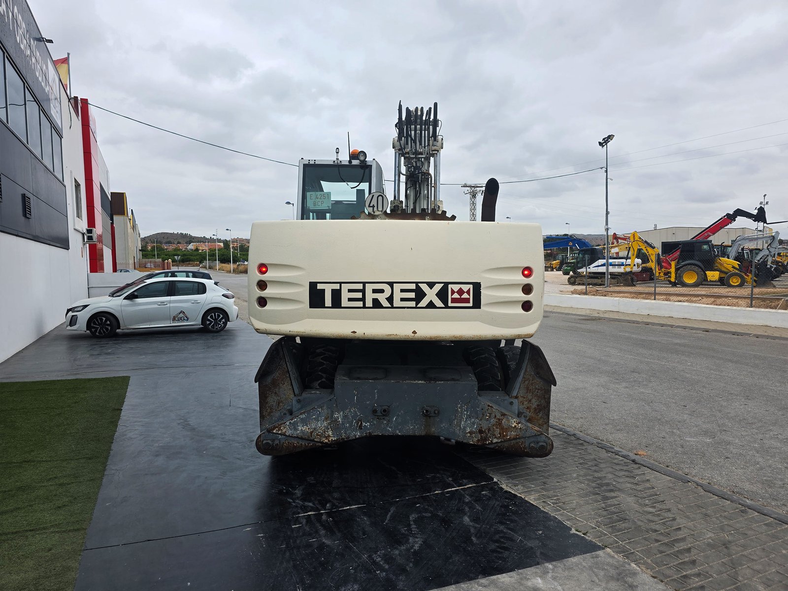 Terex Atlas 1805 segunda mano vista lateral Excavadora de ruedas Terex Atlas 1805 Atlas 1805 trabajando en obra pública Vista frontal Terex Atlas 1805 usada